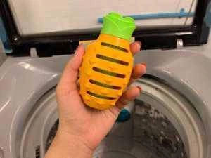 person holding Laundry Masher